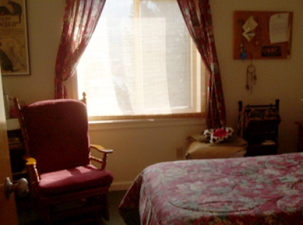 Sunny window with chair and bed